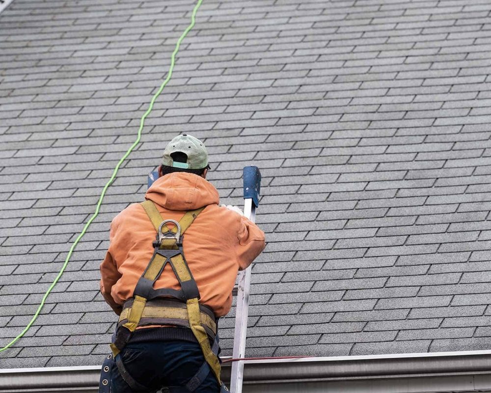 imgi_162_Roof-inspector-climbing-a-ladder-to-inspect-roof